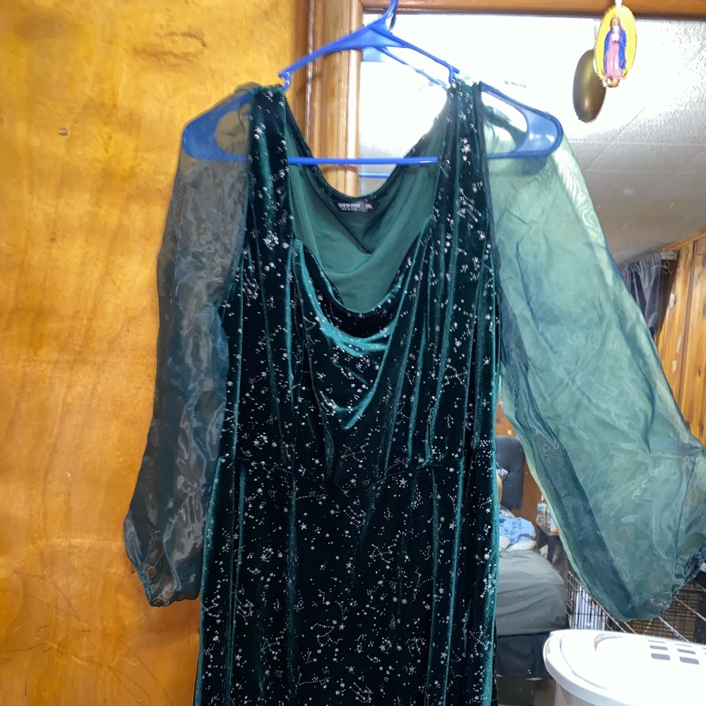 Green velvet dress with mesh sleeves.
